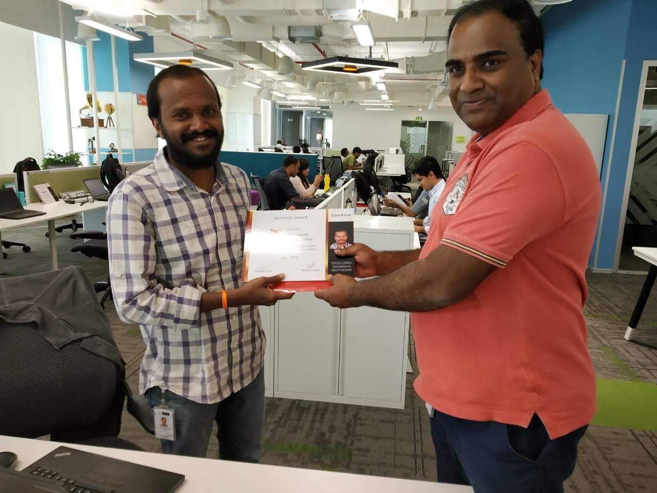 Sateesh receiving a quarterly award at PFSweb